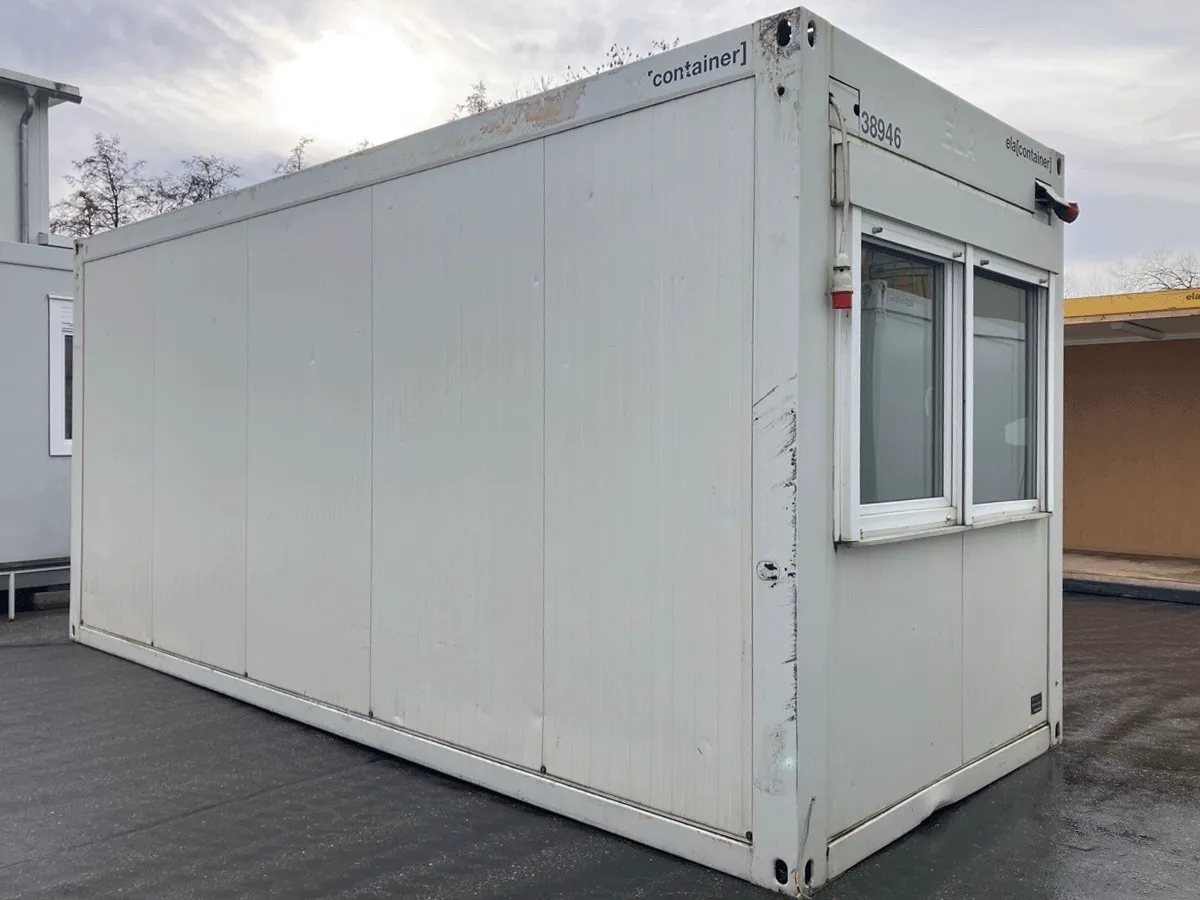 Gebrauchter Bürocontainer ELA Container grau mit Schiebefenster und Rolllade Seitenansicht