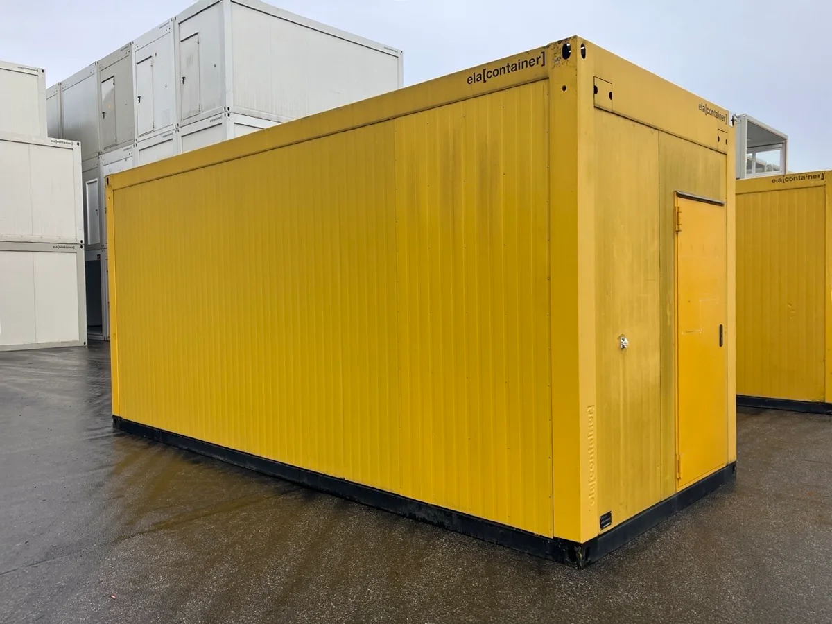Gebrauchter Bürocontainer ELA Container gelb Rückansicht mit Eingangstür