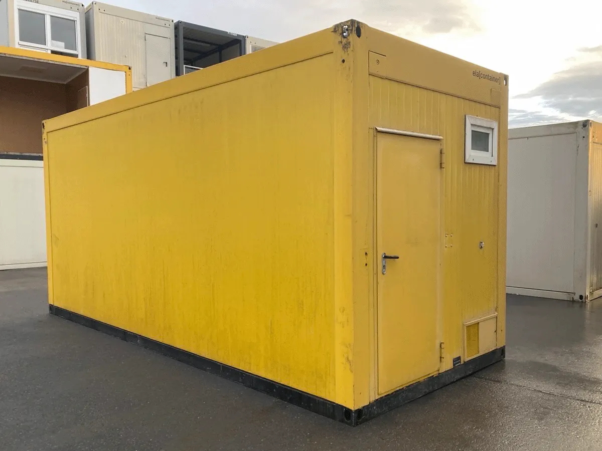 gebrauchter buerocontainer 20 fuss gelb mit eingangstuer und kleinem fenster aussenansicht