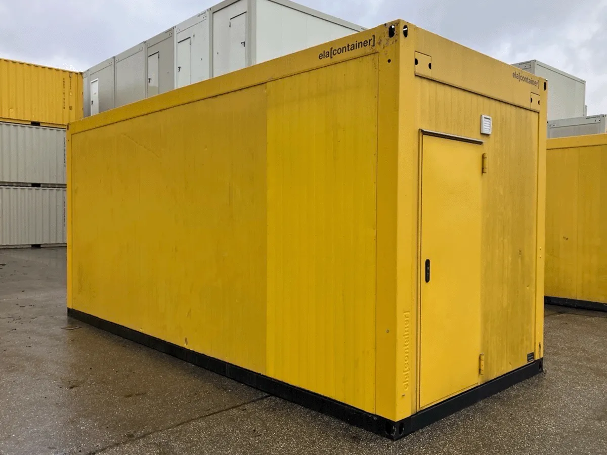 Gebrauchter Bürocontainer ELA Container gelb Rückansicht mit Eingangstür