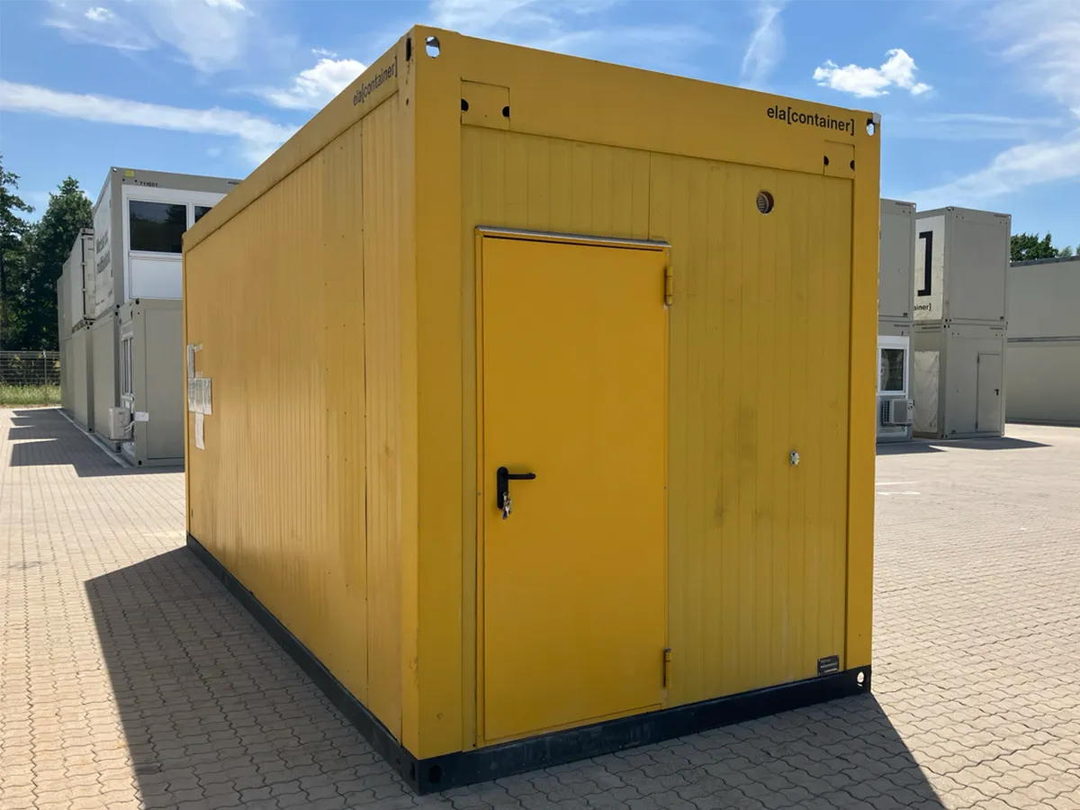 Gebrauchter Bürocontainer ELA Container gelb mit grauer Außentür, Außenansicht