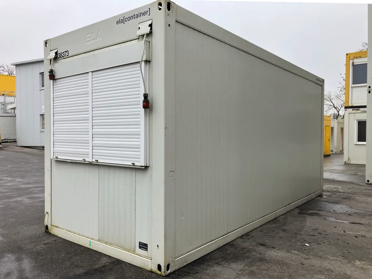 Gebrauchter Bürocontainer ELA Container grau mit geschlossenem Rolllade Außenansicht