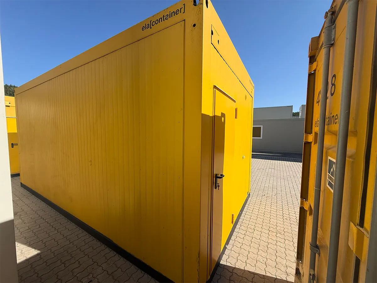 Gebrauchter Bürocontainer ELA Container gelb mit Außentür, Eckansicht